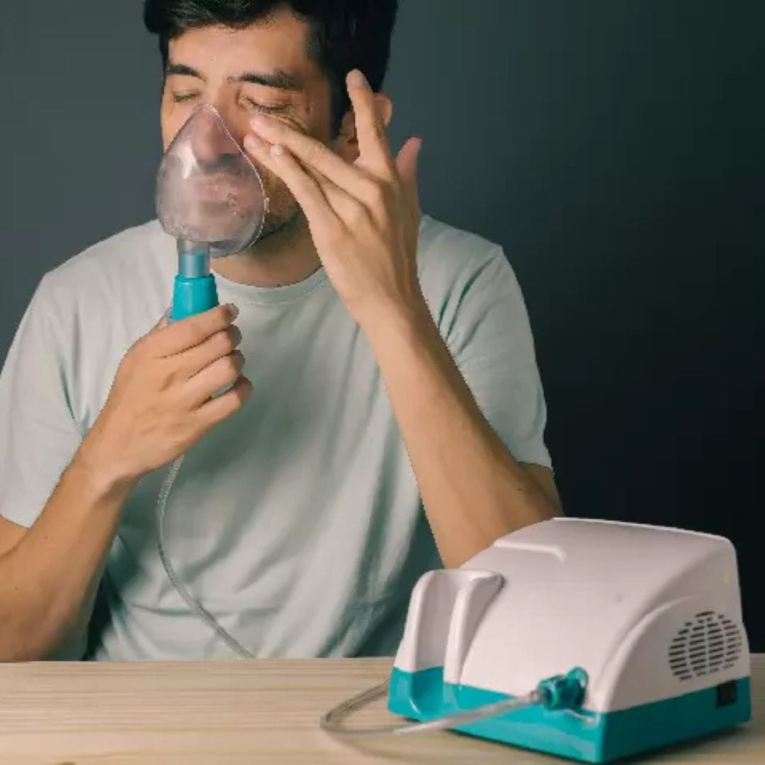 Types of Nebulisers banner image showing a man using a nebuliser